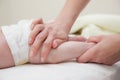 Baby Legs Massage Hands Royalty Free Stock Photo