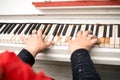 Close-up female hands playing the piano Royalty Free Stock Photo