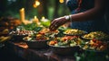 Close-up of female hands preparing healthy salad on table