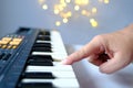 Close-up of female hands presses the black, white keys of the electronic piano, plays a melody, musician enjoys music, learning Royalty Free Stock Photo