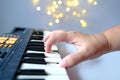 Close-up of female hands presses the black, white keys of the electronic piano, plays a melody, musician enjoys music, learning Royalty Free Stock Photo