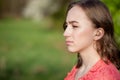 Close-up Of Female Hands Putting Hearing Aid In Ear. Modern digital in the ear hearing aid for deafness and the hard of hearing Royalty Free Stock Photo