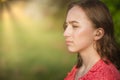 Close-up Of Female Hands Putting Hearing Aid In Ear. Modern digital in the ear hearing aid for deafness and the hard of hearing Royalty Free Stock Photo