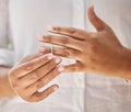 Close up of female hands removing wedding ring. Woman taking off ring after her divorce. Woman breaking off engagement Royalty Free Stock Photo