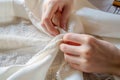 Close up female hands stitch white fabric on modern sewing machine Royalty Free Stock Photo