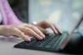 Close-up on female hands typing on laptop keyboard Royalty Free Stock Photo