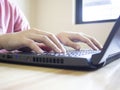 Close up of female hands typing on modern laptop keyboard Royalty Free Stock Photo
