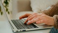 Close up female hands of unrecognizable business woman professional user worker using typing on laptop. Cropped view Royalty Free Stock Photo