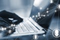 Close up of female hands using laptop on desk with glowing video conference hologram and polygonal connections on blurry