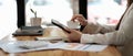 Close-up of female hands using modern digital tablet at office, side view of business woman hands typing text Royalty Free Stock Photo