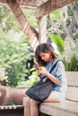 Close-up of female hands using modern smart phone while working,Young woman using a touchscreen smartphone Royalty Free Stock Photo