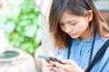 Close-up of female hands using modern smart phone while working,Young woman using a touchscreen smartphone Royalty Free Stock Photo