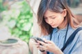 Close-up of female hands using modern smart phone while working,Young woman using a touchscreen smartphone Royalty Free Stock Photo