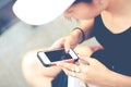 Close-up of female hands using modern smart phone while working,Young woman using a touchscreen smartphone with copy space Royalty Free Stock Photo