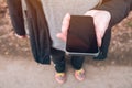 Close up of female hands using smartphone outdoors Royalty Free Stock Photo