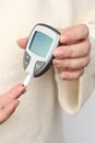 Close-up female hands, woman makes test with lancet pen and glucometer, Medicine, glycemia, healthcare and medical concept