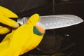 Close up of female hands in yellow protective rubber gloves, Royalty Free Stock Photo