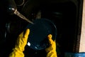 Close up of female hands in yellow protective rubber gloves, Royalty Free Stock Photo