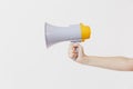 Close up female holds in hand bullhorn public address megaphone isolated on white background. Hot news, announce Royalty Free Stock Photo