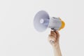 Close up female holds in hand bullhorn public address megaphone isolated on white background. Hot news, announce Royalty Free Stock Photo