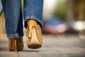 Close-up of female in jaguar spotted shoes walking