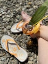 A glass of orange juice and a piece of lemon on the beach Royalty Free Stock Photo