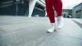 Close up female legs running on urban street. Woman legs jogging outdoor.