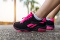 Close up of female legs wearing sneakers Royalty Free Stock Photo