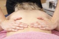 Close Up of female masseuse with client