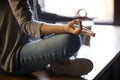 Close up of female meditating on table with mudra hands