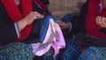 Close-up female Mien hilltribe embroider pattern colored thread at Doi Mae Salong