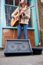 Close Up Of Female Musician Busking Playing Acoustic Guitar Outdoors In Street Royalty Free Stock Photo