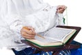 Close-up female muslim reading Quran on white Royalty Free Stock Photo