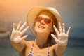 Close-up of female with opened hands coated with tanning cream. Royalty Free Stock Photo