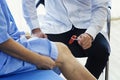 Close-up of female physiotherapist massaging the leg of patient in a physio room