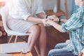 Close up of female psychotherapist holding hands of child patient Royalty Free Stock Photo