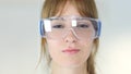 Close Up of Female Reseach Scientist, Doctor in Protective Glasses Royalty Free Stock Photo