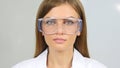 Close Up of Female Reseach Scientist, Doctor Wearing Protective Glasses Royalty Free Stock Photo