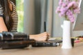 Close-up of female right-hand working on the pen table Royalty Free Stock Photo