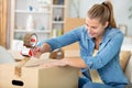 close-up female sealing cardboard box with adhesive tape Royalty Free Stock Photo