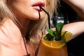 Close up of female sensual lips and mouth drinking lemonade cocktails. Cocktail menu. Party and summer. Fruit cocktail Royalty Free Stock Photo