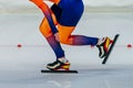 close-up female skaters in bright skin suit run in speed skating competition