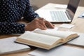 Close up of female student read book preparing for exam Royalty Free Stock Photo