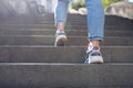 Female tourist in casual clothes going upstairs outdoors Royalty Free Stock Photo