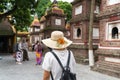 Close-up female tourist visiting Tran Quoc ancient pagoda, the oldest Buddhist temple in Hanoi, Vietnam Royalty Free Stock Photo