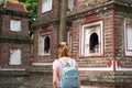 Close-up female tourist visiting Tran Quoc ancient pagoda, the oldest Buddhist temple in Hanoi, Vietnam Royalty Free Stock Photo