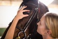 Close up of female vet checking horse eye