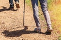 Close-up of feminine feet hiking on the trail