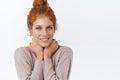 Close-up feminine, tender and sensual redhead curly woman with messy bun, embrace her neck, gently touching it with