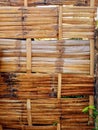 Close up of fence made of bamboo poles in the French West Indies. Frontal view of round wooden posts. Construction and Royalty Free Stock Photo